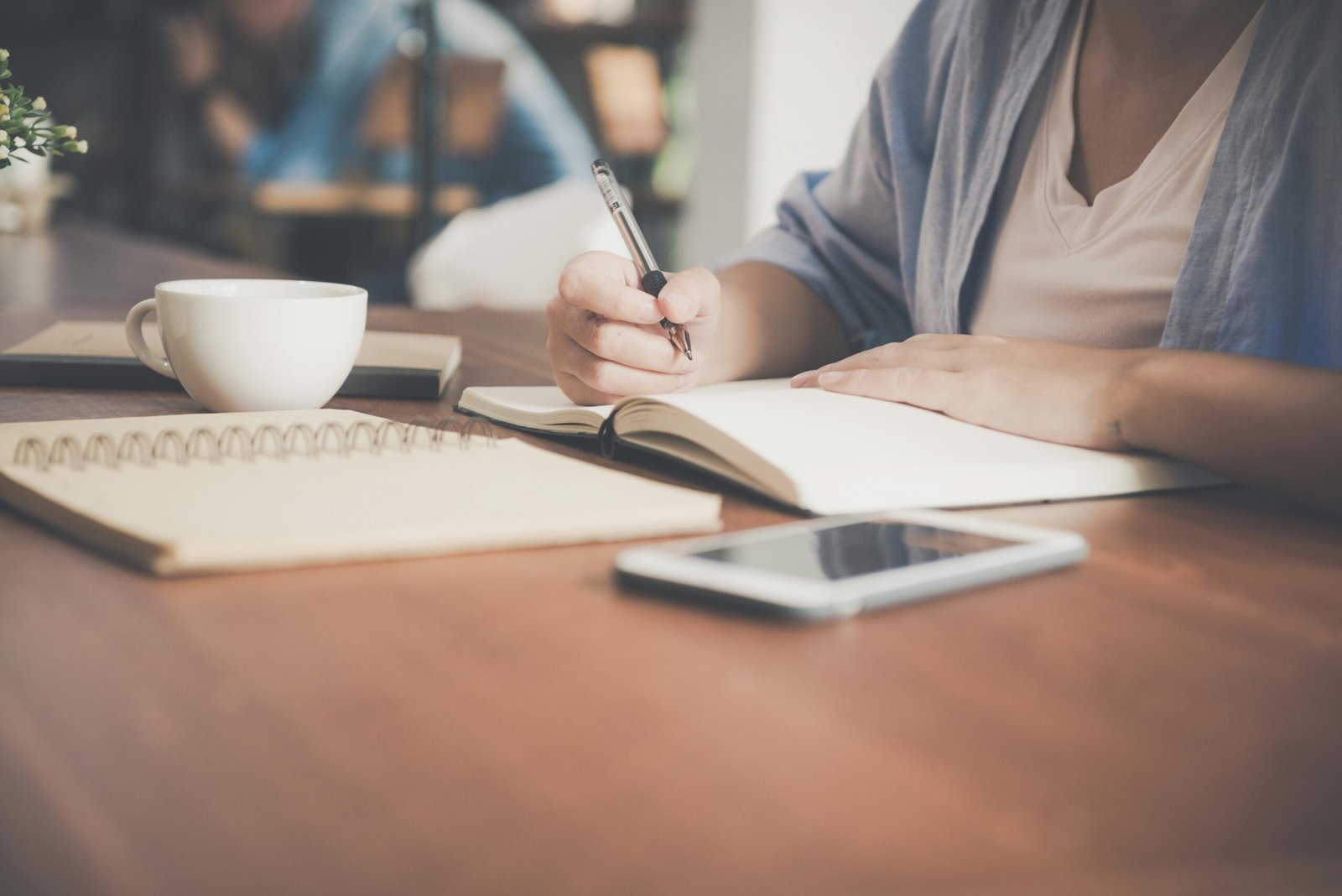 writing in a notebook